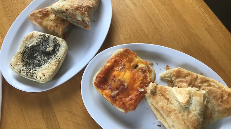 Australian Bakery Cafe offers a variety of savory hand pies and pastys. Pictured, from left: Steak and Kidney pie, Vegetable Pasty, Ned Kelly and the Outback Pepperjack Chicken Pie. / Ligaya Figueras