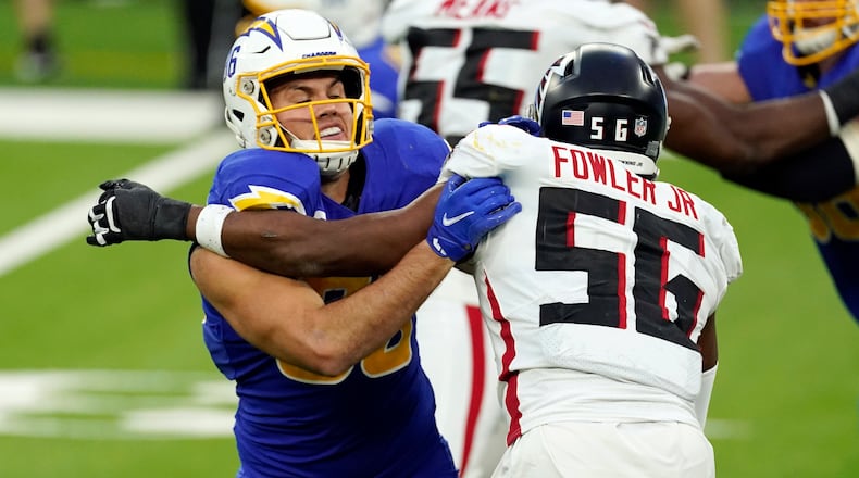 Los Angeles Chargers tight end Hunter Henry (left) works against Atlanta Falcons defensive end Dante Fowler Jr. (56) during the second half Sunday, Dec. 13, 2020, in Inglewood, Calif. (Ashley Landis/AP)