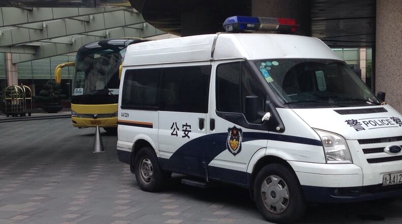 A police vehicle was parked in front of the UCLA team bus at the Hyatt Regency hotel in Hangzhou, China, Tuesday morning.