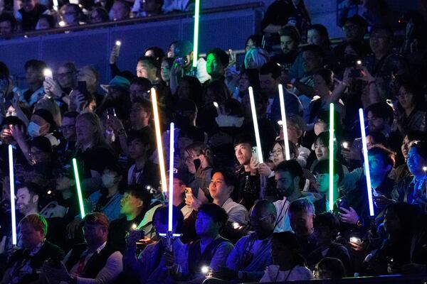 Fans watch opening act during the Star Wars Celebration in Chiba, near Tokyo, Friday, April 18, 2025. (AP Photo/Hiro Komae)
