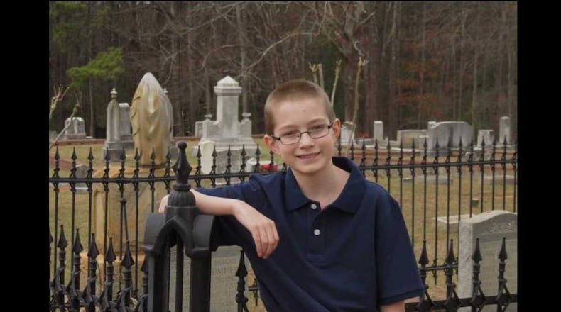 This is Andrew Bramlett posing for a photo in a cemetery. He is 11. Andrew (vice president Kennesaw Historical Society) will give a tour of the Kennesaw Cemetery on Oct. 21, 2017.