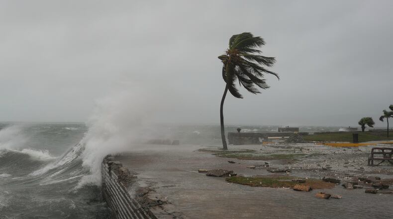 Waves splash in Kingston, Jamaica, as Hurricane Melissa approaches, Tuesday, Oct. 28, 2025. (AP Photo/Matias Delacroix)