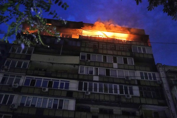 A fire burns at a residential building after a Russian attack in Kyiv, Ukraine, early Thursday, July 10, 2025. (AP Photo/Efrem Lukatsky)