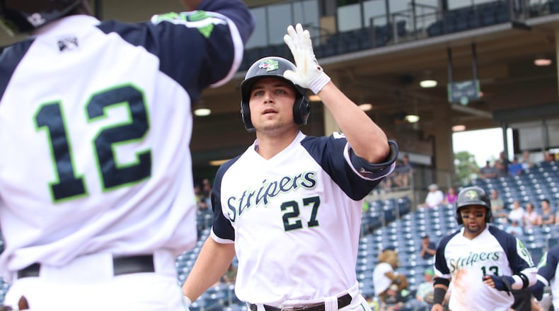 Gwinnett's Austin Riley receives congratulations after bringing home another run. (Photo by Matthew Caldwell/Gwinnett Stripers)
