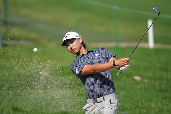 Min Woo Lee, of Australia, hits a bunker shot on the second hole during the first round of the Rocket Classic golf tournament at the Detroit Golf Club, Thursday, June 26, 2025, in Detroit. (AP Photo/Paul Sancya)