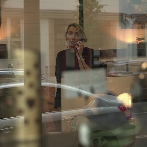Véronique Bertrand, a funeral director, works the phones Sunday, June 28, 2026, at her office in Paris. (AP Photo/John Leicester)