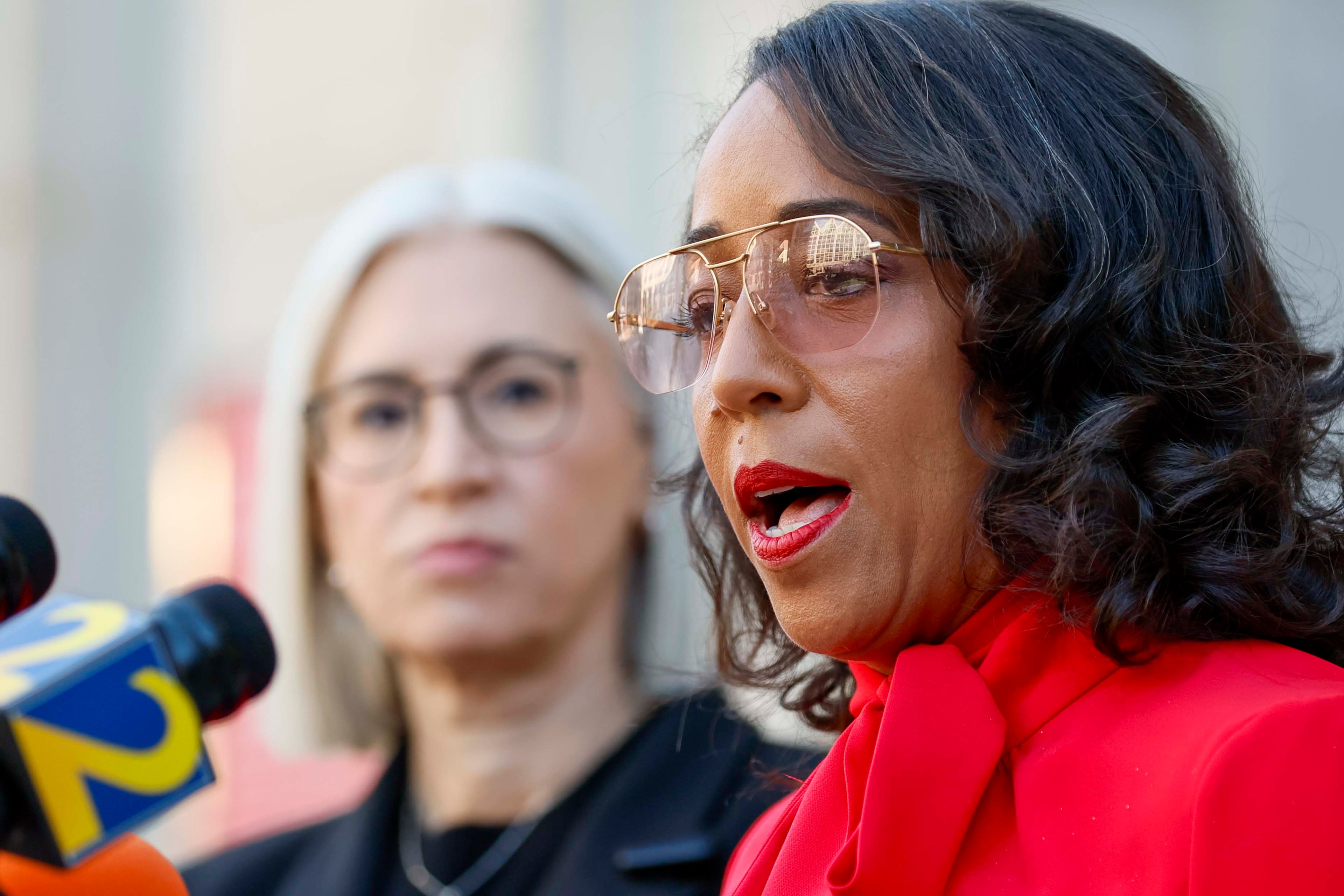 Fulton County Commissioners Dana Barrett (left) and Mo Ivory, both Democrats, recently spoke at a news conference in Atlanta.