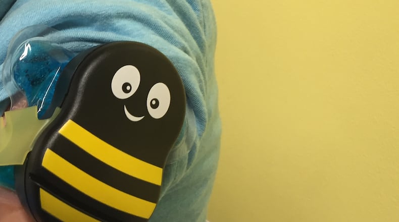 This buzzing bee is one tool used at Nationwide Children' s Hospital in Columbus, Ohio to make flu shots less painful. The cold pack wings and buzzing body lessens how much patients feel the prick of the needle. The product was developed by local pediatrician Dr. Amy Baxter Photo provided by Nationwide Children s Hospital