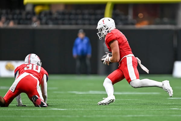 North Gwinnett linebacker Jake Godfree intercepts the ball and runs for a touchdown against Grayson during the second half of the Corky Kell + Dave Hunter Classic Wednesday, Aug. 12, 2026 at the Mercedes-Benz Stadium in Atlanta. (Daniel Varnado for the AJC)