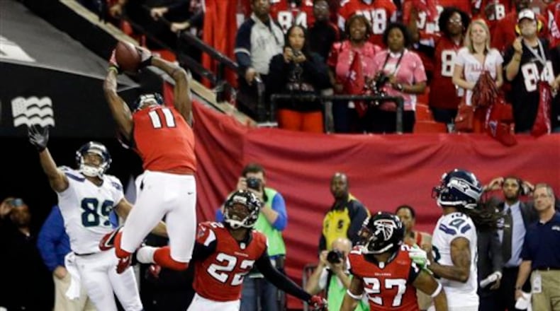 Atlanta Falcons' Julio Jones (11) intercepts a pass on a Seattle Seahawks quarterback Russell Wilson Hail-Mary pass during the second half of an NFC divisional playoff NFL football game Sunday, Jan. 13, 2013, in Atlanta. The Falcons won 30-28. (AP Photo/David Goldman)