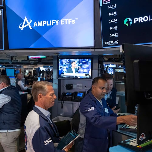 Specialists Dilip Patel, right, and Trader Robert Charmak, center, work on the floor of the New York Stock Exchange, Thursday, Aug. 27, 2026, in New York. (AP Photo/Yuki Iwamura)