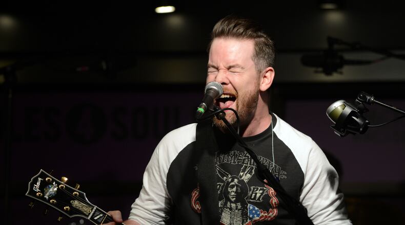 NASHVILLE, TN - APRIL 01: Singer-songwriter David Cook performs at the Soles4Souls charity concert, sponsored by Barefoot Wine & Bubbly at the Bridge Building on April 1, 2014 in Nashville, Tennessee. (Photo by Jason Davis/Getty Images for Barefoot Wines)