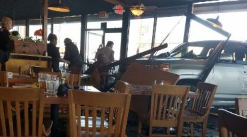 Malone's Steak and Seafood will be closed for repairs after a man crashed through the window and injured three people in the dining room Wednesday. (Credit: Channel 2 Action News)