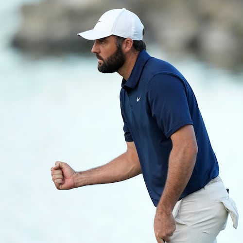 Scottie Scheffler pumps his fist after making a par on the 18th hole during the third round of the American Express golf event on the Pete Dye Stadium Course at PGA West Saturday, Jan. 24, 2026, in La Quinta, Calif. (AP Photo/Ross D. Franklin)
