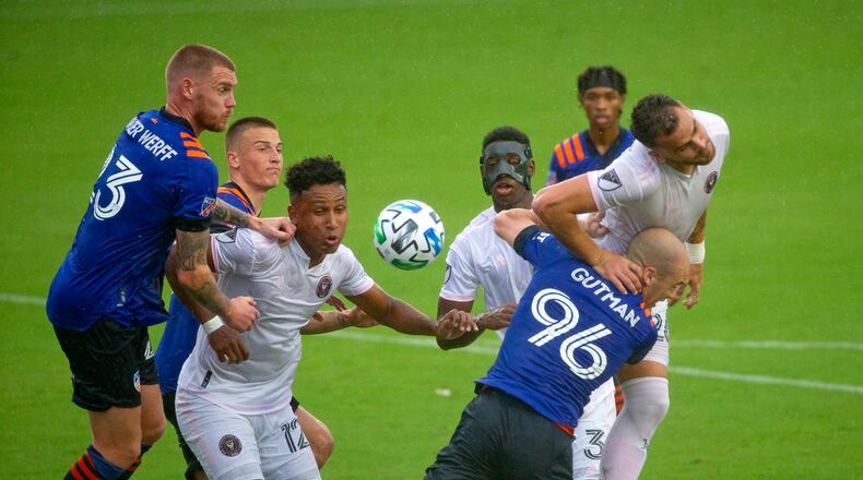 Inter Miami CF defender Leandro Gonzalez Pirez (26) heads the ball in front FC Cincinnati defender Andrew Gutman (96) during the first half of an MLS soccer match at Inter Miami CF Stadium on Sunday, November 8, 2020, in Fort Lauderdale, Florida. (David Santiago/Miami Herald/TNS)