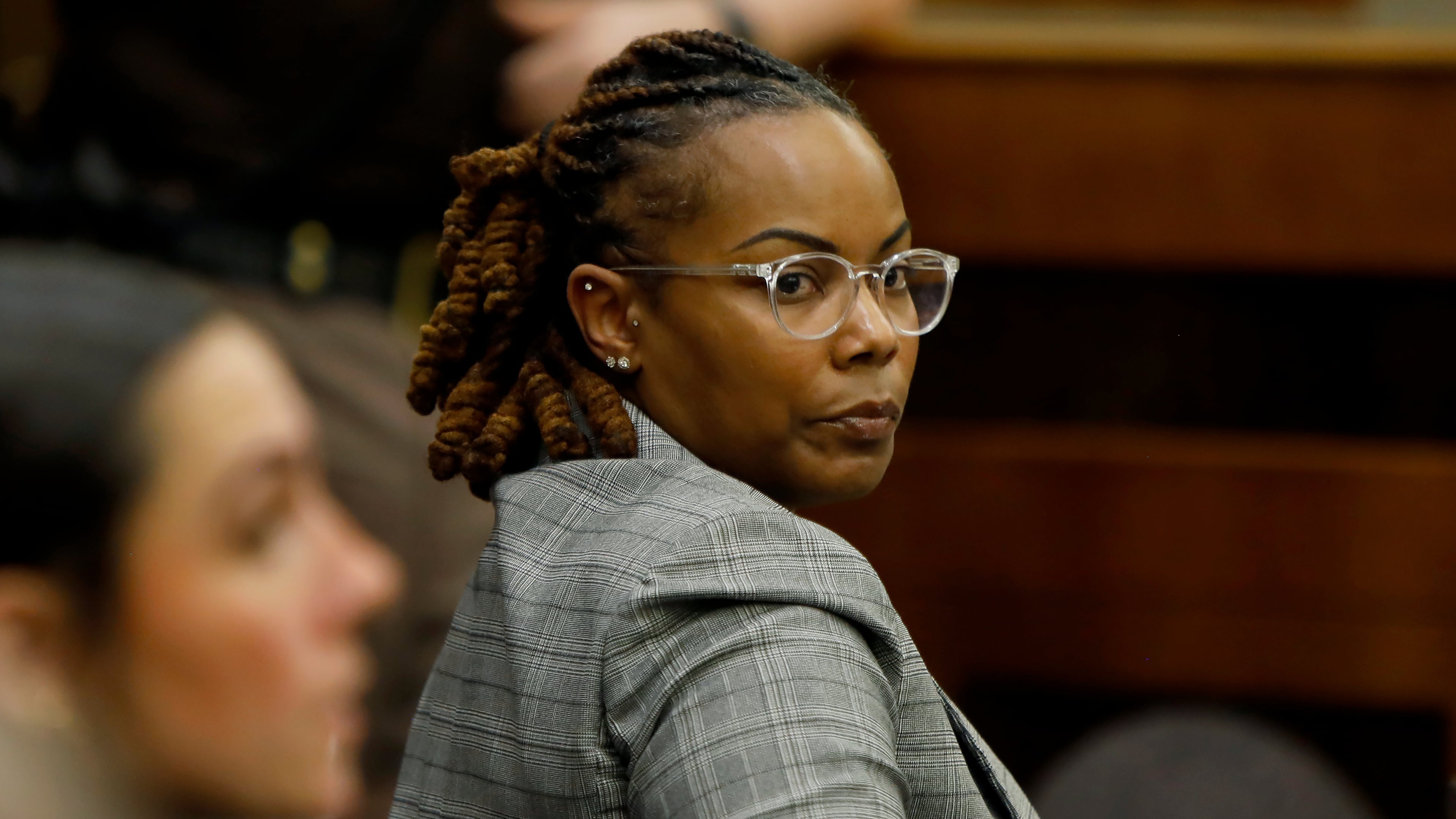 Former Richneck Elementary School assistant principal Ebony Parker looks back into the courtroom during Abby Zwerner's lawsuit against her Tuesday, Oct. 28, 2025, in Newport News, Va. (Stephen M. Katz/The Virginian-Pilot via AP, Pool)