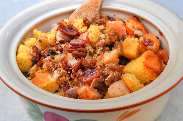 C.W. Cameron has served a variety of dressings with her Thanksgiving meal, but Sausage and Apple Cornbread Dressing is a constant on her holiday table. (Styling by Ligaya Figueras / Chris Hunt for the AJC)