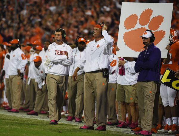 Clemson head coach Dabo Swinney, left, looks on from the sideline during the first half of an NCAA college football game against Boston College, Saturday, Oct. 17, 2015, in Clemson, S.C. (AP Photo/Rainier Ehrhardt)