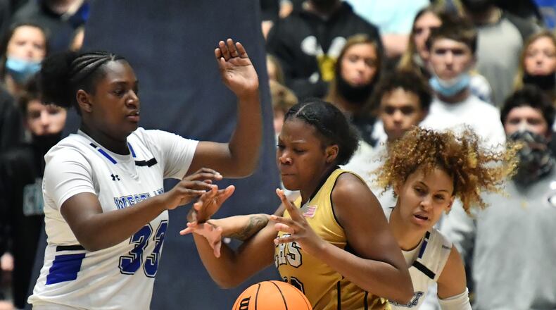 March 12, 2021 Macon - Carrollton's Jenee Edwards (32) fights for the ball with Westlake's Faith Bryant (32) and Westlake's Brianna Turnage (right) during the 2021 GHSA State Basketball Class AAAAAA Girls Championship game at the Macon Centreplex in Macon on Friday, March 12, 2021 Westlake won 64-46 over Carrollton. (Hyosub Shin / Hyosub.Shin@ajc.com)