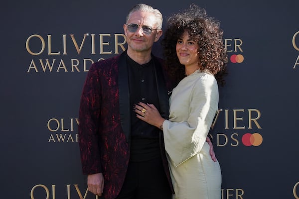 Martin Freeman and Rachel Mariam pose for photographers upon arrival at the Olivier Awards on Sunday, April 6, 2025, in London. (Photo by Alberto Pezzali/Invision/AP)