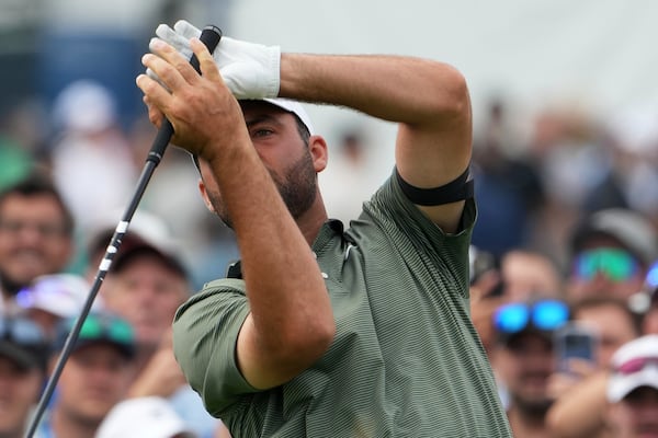 Scottie Scheffler reacts to his tee shot on the 15th hole during the second round of the U.S. Open golf tournament at Oakmont Country Club Friday, June 13, 2025, in Oakmont, Pa. (AP Photo/Gene J. Puskar)