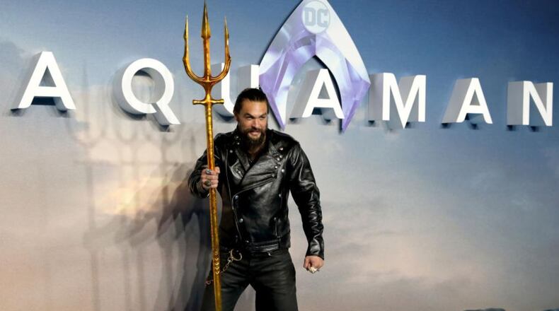 "Aquaman" star Jason Momoa had some fun during a wedding shoot in Hawaii, agreeing to photobomb the newlyweds in several photos.