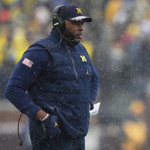 Michigan head coach Sherrone Moore watches from the sideline during the second half of an NCAA college football game against Ohio State, Saturday, Nov. 29, 2025, in Ann Arbor, Mich. (AP Photo/Ryan Sun)