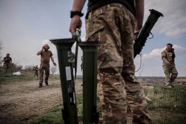 In this photo provided by Ukraine's 24th Mechanized Brigade press service, servicemen of 3rd mechanized battalion, practice on the training ground at an undisclosed location in the east of Ukraine, Thursday, March 27, 2025. (Oleg Petrasiuk/Ukraine's 24th Mechanized Brigade via AP)