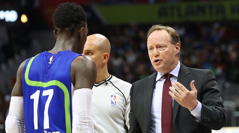 March 6, 2017, Atlanta: Atlanta Hawks head coach Mike Budenholzer speaks with guard Dennis Schroder before benching him in the third quarter for the remainder of the game against the Golden State Warriors during a NBA basketball game on Monday, March 6, 2017, in Atlanta. Curtis Compton/ccompton@ajc.com