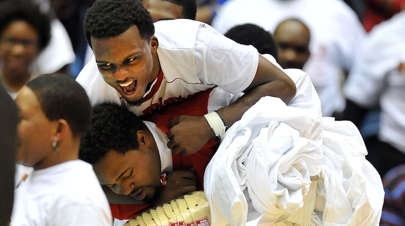 Jenkins' Eric Johnson celebrates the Warriors' 2015 Class AAA boys state championship game . (Kent D. Johnson/AJC)