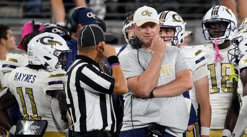 Georgia Tech coach Brent Key, right, talks with an official during the second half of the team's NCAA college football game against Wake Forest in Winston-Salem, N.C., Saturday, Sept. 23, 2023. (AP Photo/Chuck Burton)