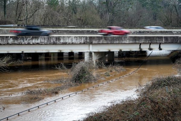 Water levels in Noonday Creek rise under I-575 on Saturday, Jan 10, 2026, in Woodstock. Portions of North Georgia are under a flood watch until Saturday evening, according to the National Weather Service. (Ben Hendren for the AJC)