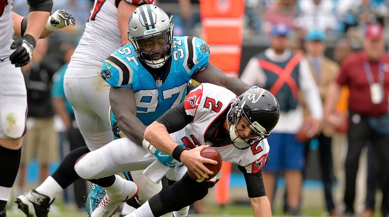 CHARLOTTE, NC - NOVEMBER 05:  Mario Addison #97 of the Carolina Panthers sacks Matt Ryan #2 of the Atlanta Falcons in the fourth quarter during their game at Bank of America Stadium on November 5, 2017 in Charlotte, North Carolina.  (Photo by Grant Halverson/Getty Images)