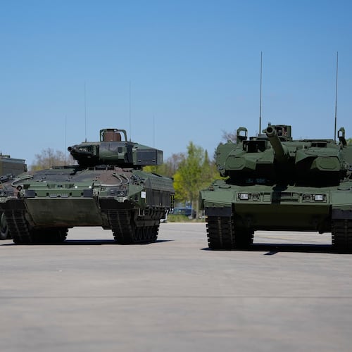 FILE - A boxer armoured personnel carrier, from left, a Puma infantry fighting vehicle and a Leopard battle tank are displayed during the opening of a new production line production line of Boxer 8x8 wheeled armoured personnel carrier produced by pan-European defense company KNDS in Munich, Germany, on April 22, 2026. (AP Photo/Matthias Schrader, File)