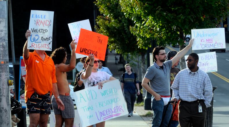 091021 Atlanta--Protesters stand, some in their underwear, at the intersection of 10th Street and Piedmont Avenue in Atlanta, Ga Wednesday, Oct 21, 2009 to make a statement about the recent raids at the Eagle club. "Out of 62 people that were in the bar harassed,we probably have 15 people who have come forward, because they are scared," Robert Kelley, an owner of the Eagle who was also in his underwear, said. "They don't need to be afraid. We didn't do anything wrong, the police did." Elissa Eubanks, eeubanks@ajc.com