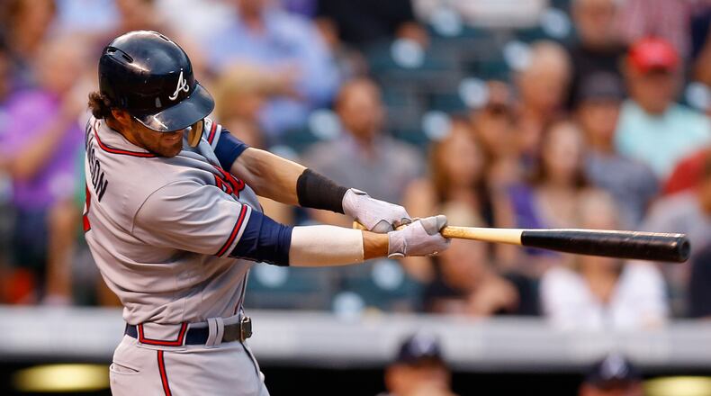 Dansby Swanson hits a two-run double Aug. 15 at Colorado. He’s had significant improvement since returning Aug. 9 from a two-week stint in Triple-A. (Photo by Justin Edmonds/Getty Images)