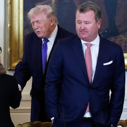 President Donald Trump speaks with Chairman, President and Chief Executive Officer of Marathon Petroleum Maryann Mannen, left, while Tallgrass Energy President and Chief Executive Officer Matt Sheehy looks on, right, during a meeting with oil executives in the East Room of the White House, Friday, Jan. 9, 2026, in Washington. (AP Photo/Alex Brandon)