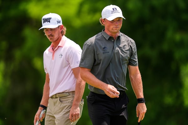 Frankie Capan III, left, and teammate Jake Knapp line up a shot on the second green during the final round of the PGA Zurich Classic golf tournament at TPC Louisiana in Avondale, La., Sunday, April 27, 2025. (AP Photo/Gerald Herbert)
