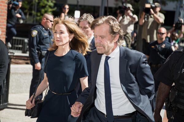 Actress Felicity Huffman arrives at federal court alongside her husband, actor William Macy, for her sentencing in September.