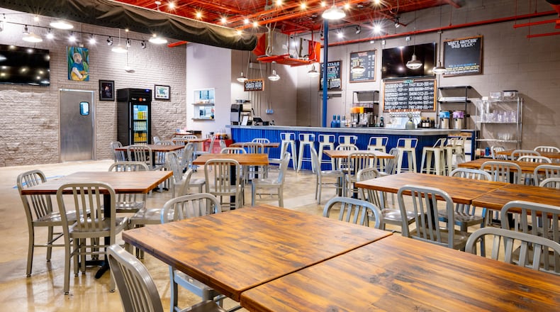 The taproom at the Toco Hill Wild Heaven features two bars with 12 taps each, as well as a 48-seat event space, outdoor courtyard and full kitchen with an on-site smoker. (Courtesy of Chris Rank)