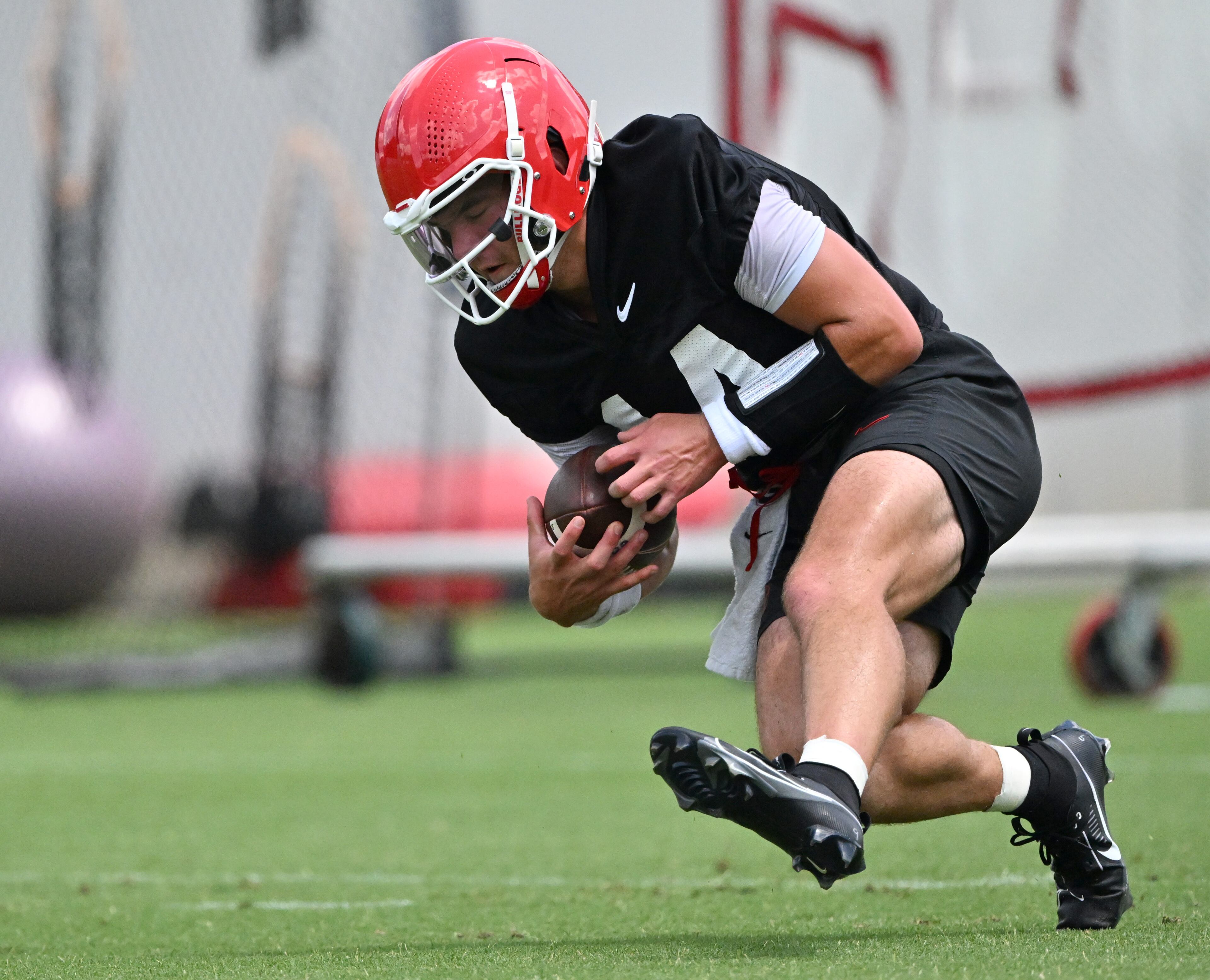 Georgia quarterback Gunner Stockton (14) runs a drill during a football practice at the University of Georgia practice facility, Thursday, July 31, 2025, in Athens. (Hyosub Shin / AJC)