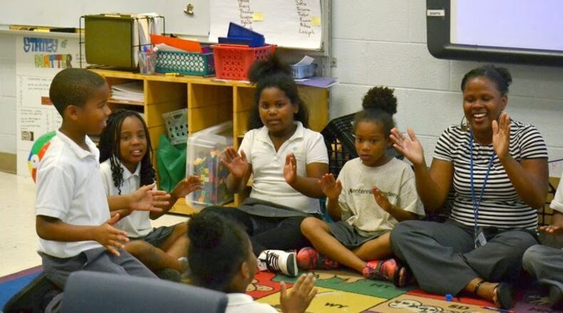 Photo 2: Neil Marie Nicholson (far right) enjoys a lesson with her students at Centennial Academy, a charter school in downtown Atlanta. CONTRIBUTED(From left to right: Aiden Jenkins, Kiara Walker, SaNiya Vines, Janaiya Doby and teacher Neil Marie Nicholson)