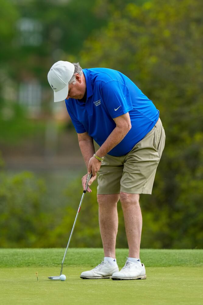 Tech coaches play golf