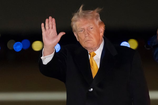 President Donald Trump waved after arriving at Joint Base Andrews in Maryland. He was returning from a holiday break in Florida. (Alex Brandon/AP)