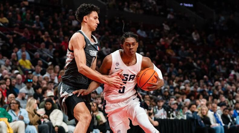 Cody Williams of Team USA (R) dribbles past Zaccharie Risacher of World Team (L) during the Nike Hoop Summit at the Moda Center on Saturday, April 8, 2023 in Portland, Ore. The USA Team went on to win 90-84 over the World Team. (Photo by Ali Gradischer for The Oregonian/OregonLive)
