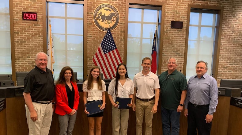 Milton’s Mayor and City Council recently recognized Milton High School seniors Ella Katekovich and Jeslyn Guo for their enthusiasm, commitment, and initiative to bring glass recycling back to the city. (Courtesy City of Milton)