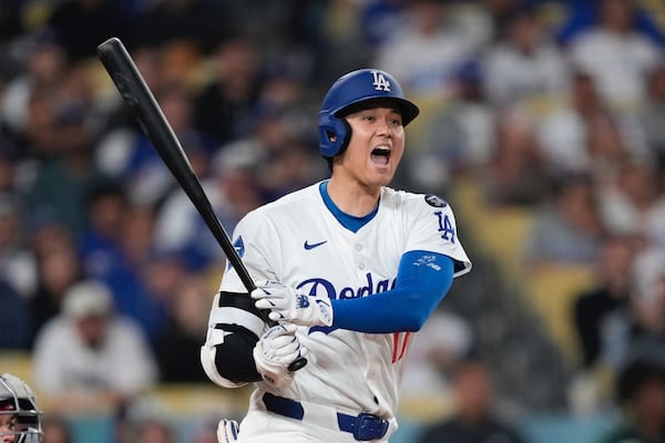 Los Angeles Dodgers' Shohei Ohtani yells as he hits a foul ball during the eighth inning of a baseball game against the Los Angeles Angels, Friday, May 16, 2025, in Los Angeles. (AP Photo/Mark J. Terrill)