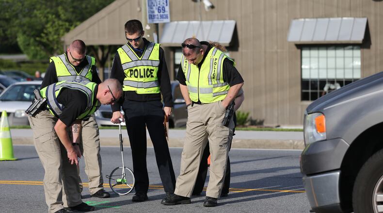 Police investigate after a child was hit by a vehicle in Marietta on Thursday. (BEN GRAY / BGRAY@AJC.COM)