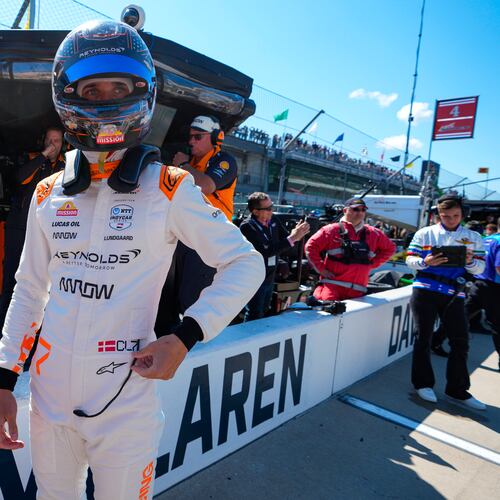FILE - Christian Lundgaard, of Denmark, waits to climb into his car before the start practice for the Indianapolis 500 auto race at Indianapolis Motor Speedway in Indianapolis, May 23, 2025. (AP Photo/Michael Conroy, File)
