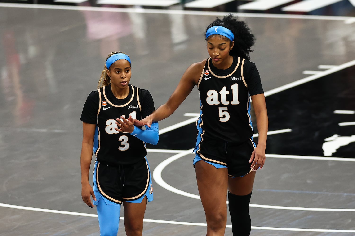 Atlanta Dream guard Jordin Canada (3) and forward Angel Reese (5) react during the second half of a WNBA game at State Farm Arena on Sunday, May 17, 2026, in Atlanta. (Colin Hubbard for the AJC) 